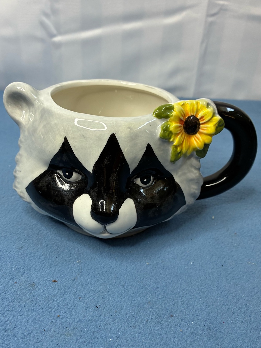 Whimsical Raccoon Ceramic Mug with Yellow Sunflower Accent